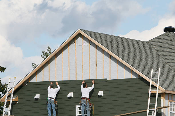 Professional Storm Damage Siding Repair technician working in Greenville, IN